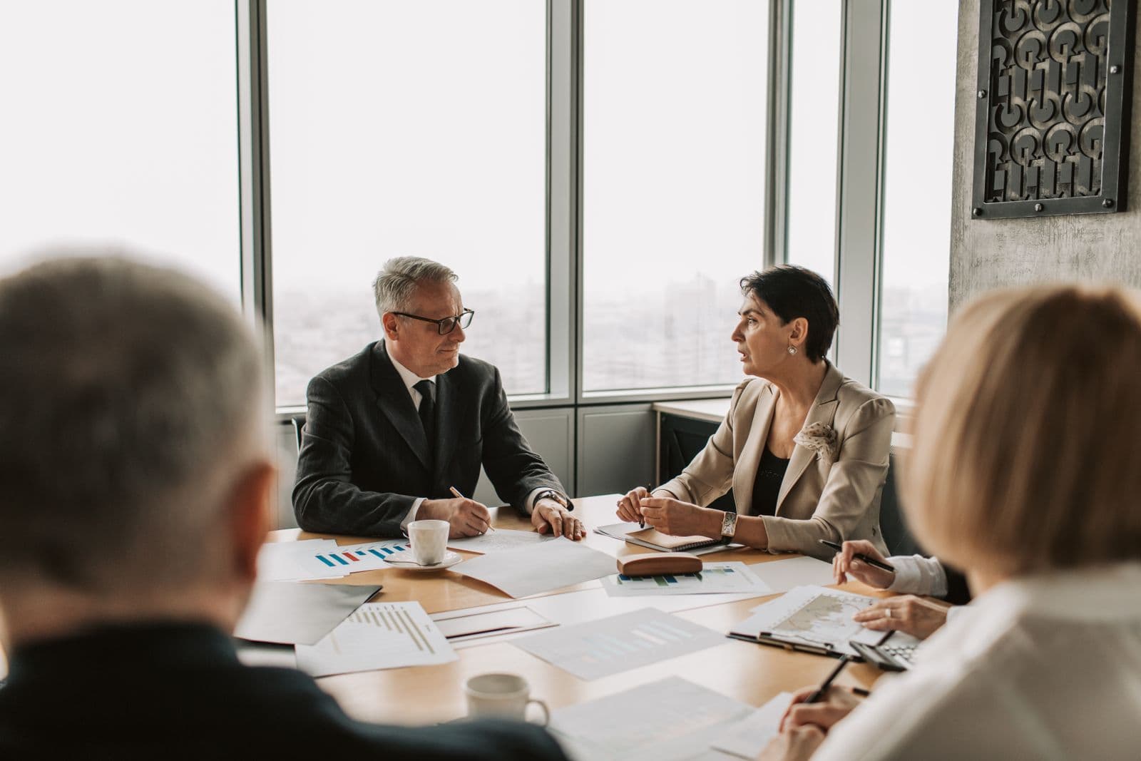 Business professionals in a strategic meeting discussing a decision